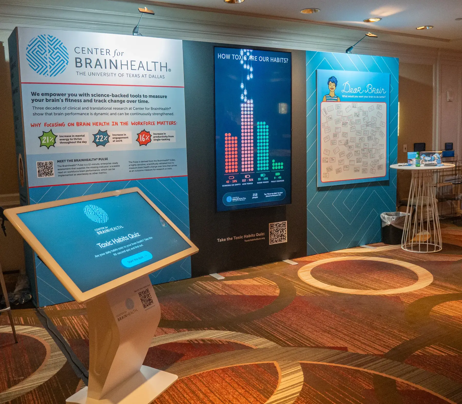 The whole booth: the Center for BrainHealth wall, the live display, the Dear Brain wall and the kiosk